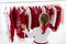 Clothes rack with red Christmas knit wear