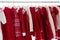 Clothes rack with red Christmas knit wear