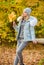 Clothes for rest. Woman enjoy autumn season in park. Warm knitwear. Girl relaxing in nature wearing knitwear suit and