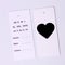 Clothes tag, double-sided heart label mockup. Fashion, people and shopping concept - close-up of a price tag of a garment