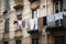 clothesline with laundry hanging out a window in the city