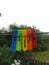 Clothespins in rainbow colors in raindrops