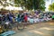 A clothing market on a dirty street in a Kenyan village. Lots of clothes, household items and caged chickens