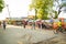 A clothing market on a dirty street in a Kenyan village. Lots of clothes, household items and caged chickens