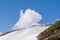 A cloud above the Aiguillette des Houches in the Mont Blanc massif in Europe, France, the Alps, towards Chamonix, in summer, on a
