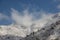 Cloud against mountain peaks