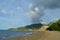 A cloud that appears over a mountain in a seaside village