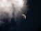 Cloud approaching a half moon