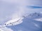 Cloud approaching pistes in Alps