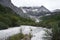 Cloud-capped mountains in the Daocheng Yading National Park, Sichuan, China.