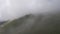 Cloud-covered mountains, top view. Summer landscape. The Caucasus, the European part of Russia