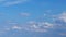 Cloud cumulus and altostratus sky scape. Clouds flying and changing with different shapes on clear blue sky.