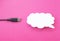 Cloud for data storage cut from paper on a pink background and cable usb, close-up, data storage on the Internet