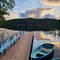 Cloud, deck bridge and boat. Sunset. Karelia