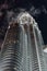 Cloud flew through the Twin Towers at night in Kuala Lumpur, Malaysia