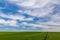 Cloud formations over a green field