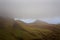 Cloud Hanging Over Mountain Range in Scotland