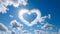 Cloud heart against the background of the sky. Heart as a symbol of affection and