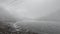 Cloud movement over frozen sela lake with snow cap mountains at morning