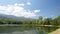 Cloud movement over mountain range and reservoir