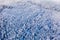 Cloud patches flow above winter forest, beautiful landscape. Coniferous woods in snow, aerial view