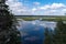 Cloud reflection in Okhotnichye Hunters Lake. Eco route in the