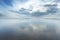 Cloud reflection on wet shoreline