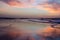 Cloud reflex on sand at the beach.