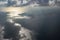 Cloud shadow view at sea in airplane.