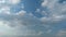 Cloud stratocumulus nature background. Blue sky with cumulus clouds and sun. Nature background of airy cloudscape