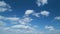 Cloud stratocumulus nature background. Blue sky with cumulus clouds and sun. Nature background of airy cloudscape