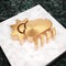 Cloud Sun Rain icon. Bronze Cloud Sun Rain symbol on white marble podium