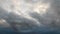 Cloud time lapse, white dark storm cumulus on blue sky