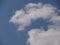 A cloud of unusual shape in the blue sky.