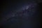 Cloudless starlit night sky with Milky Way and bright stars as panorama view