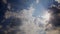 Clouds background. Cloudscape, sun rays, blue sky. Clouds. Sky background with small clouds and bright blue sky. Full HD