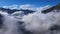 Clouds in blue sky above mountain range in natural landscape