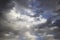 Clouds in the blue sky. A stunning gray sky. The storm is approaching. A beautiful clouds against the blue sky background. Amazing