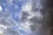 Clouds in the blue sky. A stunning gray sky. The storm is approaching. A beautiful clouds against the blue sky background. Amazing