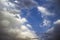 Clouds in the blue sky. A stunning gray sky. The storm is approaching. A beautiful clouds against the blue sky background. Amazing