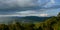 Clouds Cast A Shadow On Mountain Ridge