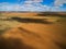 Clouds casting beautiful shadows on agricultural land.