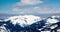 Clouds casting shadows over icy mountain range in romania borsa