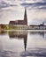 Clouds and cathedral in the old town of Schwerin are reflected in the lake Pfaffenteich
