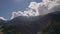 Clouds changing forms above mountains