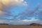 Clouds colored at sunrise in the Namib Desert