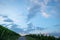 Clouds in dawn sky with road in vineyard