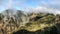 Clouds descend over the mountain into the valley