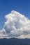 Clouds in dramatic formation over the chain of hills, with blue sky