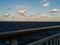 Clouds at dusk at sea from cruise ship railing